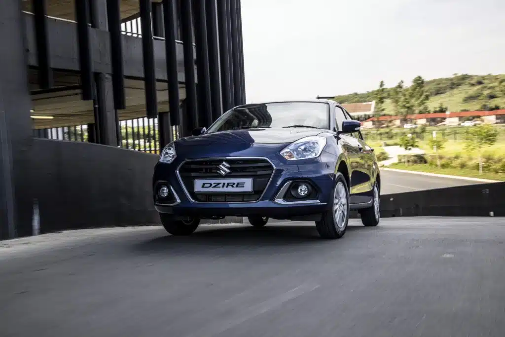 Blue Suzuki Dzire viewed from the front