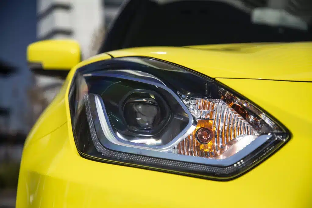 Yellow Suzuki Swift Sport Close-up on headlight